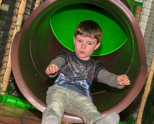 Shooting down a lide in Dino Soft Play